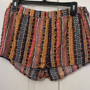 Aztec print shorts.